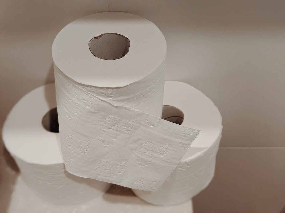 a stack of white tissue paper rolls