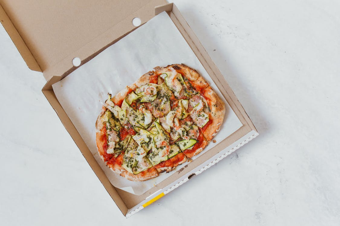 pizza in a food-grade Kraft board box