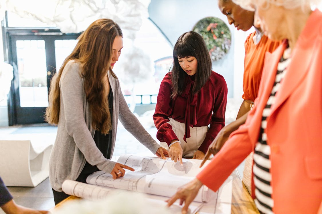 designers using tracing paper during a meeting