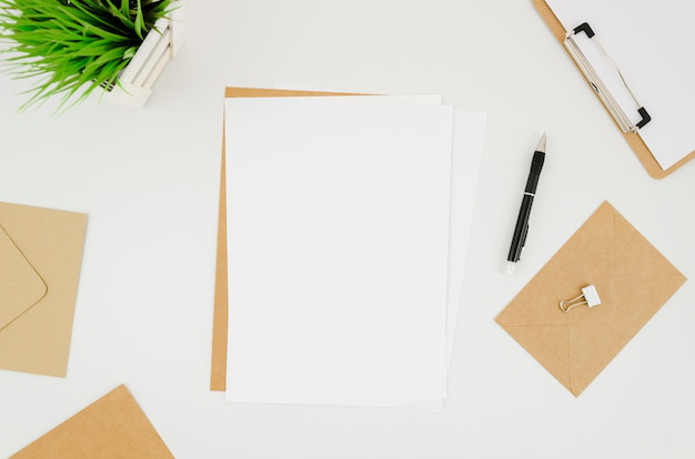 paper and pen at a workspace