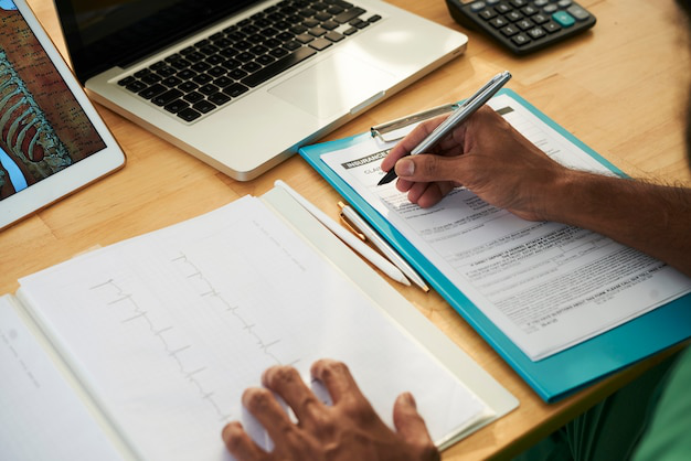  person using carbonless paper to create document copies