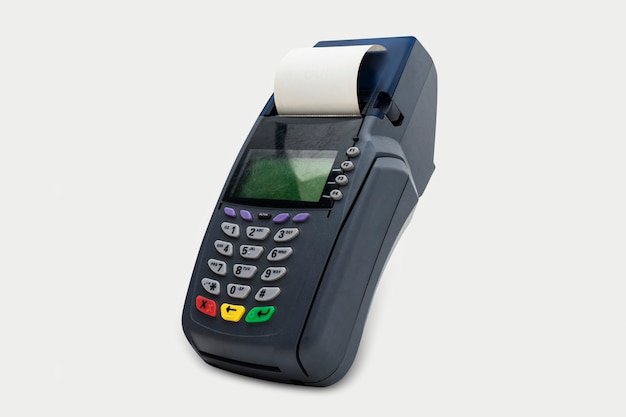 A credit card machine with a paper coming out of it