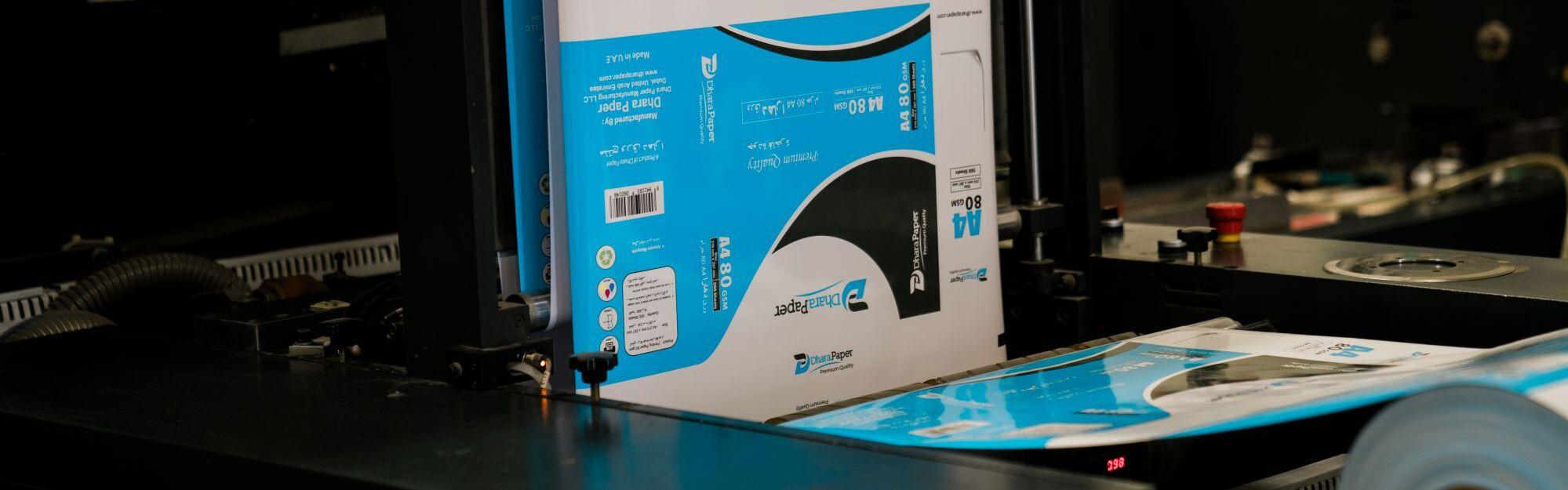 High-quality A4 paper packaging being printed at a paper factory in the UAE.